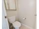 Cozy powder room features tile floors, and a modern toilet at 302 E Acapulco Ln, Phoenix, AZ 85022