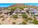 Well-maintained property featuring desert landscaping, mature trees, a pool, and a putting green at 3601 N Sonoran Hts, Mesa, AZ 85207