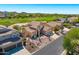 Expansive home situated on a golf course lot featuring mature landscaping, desert flora, and a three-car garage at 3601 N Sonoran Hts, Mesa, AZ 85207