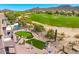 Expansive backyard with putting green, sparkling pool, mature landscaping, and mountain views at 3601 N Sonoran Hts, Mesa, AZ 85207