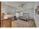 Cozy bedroom with a comfortable bed, desk and a ceiling fan at 3601 N Sonoran Hts, Mesa, AZ 85207
