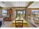 Sunny dining area offering granite counters, outdoor views, and access to an upstairs room at 3601 N Sonoran Hts, Mesa, AZ 85207