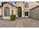 Beautiful home featuring an arched entry and desert landscaping at 3601 N Sonoran Hts, Mesa, AZ 85207