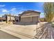 Home with desert landscaping, mature trees, and a spacious three-car garage plus long driveway at 3601 N Sonoran Hts, Mesa, AZ 85207