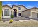 Inviting home featuring desert landscaping, an arched entryway, and a convenient three-car garage at 3601 N Sonoran Hts, Mesa, AZ 85207