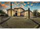 Attractive home with desert landscaping and a three-car garage, highlighted by a vibrant sunset sky at 3601 N Sonoran Hts, Mesa, AZ 85207
