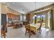 Bright eat-in kitchen boasts granite countertops, stainless appliances, and a view of the green backyard at 3601 N Sonoran Hts, Mesa, AZ 85207