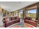 Bright and airy living room featuring comfortable seating and large windows with views at 3601 N Sonoran Hts, Mesa, AZ 85207