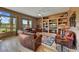 Comfortable living room featuring built-in shelves, wood floors, and a cozy seating area at 3601 N Sonoran Hts, Mesa, AZ 85207