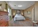 Serene main bedroom with neutral tones, plush carpeting, and a comfortable bed with decorative pillows at 3601 N Sonoran Hts, Mesa, AZ 85207