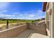 Scenic patio view overlooking lush green landscape and a clear blue sky at 3601 N Sonoran Hts, Mesa, AZ 85207