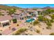 Aerial view of a backyard with a stunning pool and beautiful mountain views at 3601 N Sonoran Hts, Mesa, AZ 85207