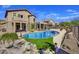 Backyard featuring a sparkling blue swimming pool and desert landscaping at 3601 N Sonoran Hts, Mesa, AZ 85207