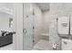 Walk-in shower with glass door and mosaic tile, creating a spa-like feel in this bright bathroom at 3710 E Hazelwood St, Phoenix, AZ 85018