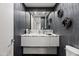 Powder room featuring dark wallpaper and marble countertop vanity at 3710 E Hazelwood St, Phoenix, AZ 85018