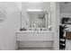 Modern bathroom vanity featuring sleek cabinetry, stylish fixtures, and contemporary design elements at 3710 E Hazelwood St, Phoenix, AZ 85018