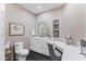 Chic bathroom featuring a vanity with modern fixtures, ample counter space, and elegant decor at 3710 E Hazelwood St, Phoenix, AZ 85018