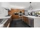 Bright modern kitchen with stainless steel appliances, an island with seating, and a clean, minimalist design at 3710 E Hazelwood St, Phoenix, AZ 85018