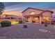 Spacious backyard with a covered patio, seating area, and decorative fire pit at 3900 S Velero St, Chandler, AZ 85249