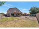 Expansive backyard featuring a covered patio and a mix of grassy and rock-covered areas at 3900 S Velero St, Chandler, AZ 85249