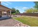 Private backyard featuring covered patio, gravel landscape, and mature trees at 3900 S Velero St, Chandler, AZ 85249