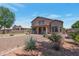 Well-maintained backyard with desert landscaping, including various plants and rock ground cover at 3900 S Velero St, Chandler, AZ 85249