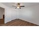 Large bedroom featuring closet, access to bathroom, and wood floors at 3900 S Velero St, Chandler, AZ 85249