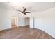 Spacious bedroom featuring vinyl floors, white walls, and a ceiling fan at 3900 S Velero St, Chandler, AZ 85249