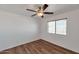Spacious bedroom featuring ceiling fan, wood floors and bright window at 3900 S Velero St, Chandler, AZ 85249