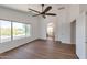 Bright bedroom featuring hardwood floors and a large window with outdoor views at 3900 S Velero St, Chandler, AZ 85249