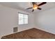 Bedroom featuring neutral walls, a ceiling fan, and a window with blinds at 3900 S Velero St, Chandler, AZ 85249