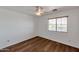 Bright bedroom featuring wood floors, ceiling fan, and bright window at 3900 S Velero St, Chandler, AZ 85249