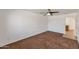 Bedroom with tan carpet, white walls, ceiling fan and neutral blinds at 3900 S Velero St, Chandler, AZ 85249
