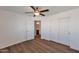 Bright bedroom with wood floors, closet, and access to the ensuite at 3900 S Velero St, Chandler, AZ 85249