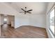 Bedroom featuring vinyl floors, bright walls, ceiling fan, and large window at 3900 S Velero St, Chandler, AZ 85249