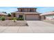 Charming two-story home with desert landscaping, a tile roof, and a two-car garage in a residential neighborhood at 3900 S Velero St, Chandler, AZ 85249