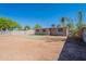 View of the backyard with block fencing and mature landscaping at 3946 W Monte Vista Rd, Phoenix, AZ 85009