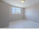 Bedroom featuring neutral paint, tiled floors, and natural light from the exterior window at 3946 W Monte Vista Rd, Phoenix, AZ 85009
