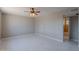 Spacious bedroom featuring tiled floors, neutral walls, and a ceiling fan at 3946 W Monte Vista Rd, Phoenix, AZ 85009