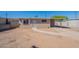 Charming single-story home with a tan brick exterior, desert landscaping, and covered parking at 3946 W Monte Vista Rd, Phoenix, AZ 85009