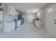 Modern kitchen featuring white cabinets, stainless steel appliances, and tiled flooring at 3946 W Monte Vista Rd, Phoenix, AZ 85009