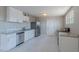 Bright kitchen featuring white cabinets, stainless steel appliances, and stylish countertops at 3946 W Monte Vista Rd, Phoenix, AZ 85009