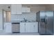 Well-equipped kitchen with stainless steel appliances, modern countertops, and ample cabinet space at 3946 W Monte Vista Rd, Phoenix, AZ 85009