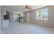 Bright, open living room featuring tiled floors, a ceiling fan, and a front door at 3946 W Monte Vista Rd, Phoenix, AZ 85009