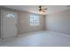 Inviting living room featuring tiled floors, bright light from windows, and a ceiling fan at 3946 W Monte Vista Rd, Phoenix, AZ 85009