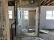 Dilapidated bathroom featuring a toilet and glass shower, awaiting renovation and a fresh, modern transformation at 3948 E Monterosa St, Phoenix, AZ 85018