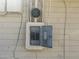 Outdoor electrical panel box mounted on a white brick wall, offering service and protection at 3948 E Monterosa St, Phoenix, AZ 85018