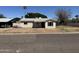 Exterior front view of a single-story home featuring neutral siding and desert landscaping at 3948 E Monterosa St, Phoenix, AZ 85018