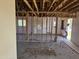 Interior with exposed studs, offering a glimpse into the home's layout and renovation potential at 3948 E Monterosa St, Phoenix, AZ 85018