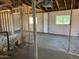 Interior shot featuring exposed wall framing and a concrete floor, ready for remodeling at 3948 E Monterosa St, Phoenix, AZ 85018